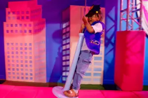 Child smiling at the PAW Patrol™ Experience: Only at CAMP